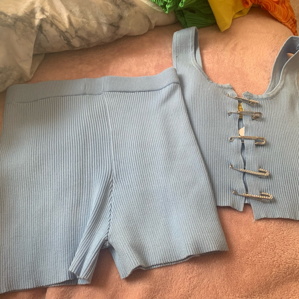 Light blue matching set. Stretch material. Never worn